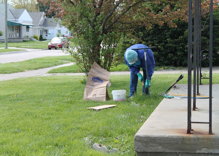 Mom working to get ready to plant some flowers.