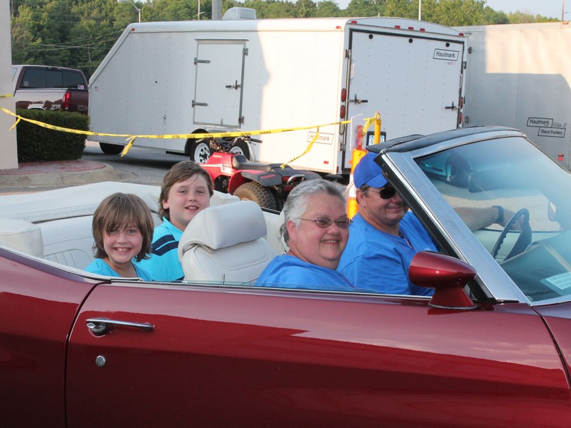 John (flash) and Joan in Joans 1972 Malibu Convertible. 
Who's that in the back seat ?  Looks like my kids, Leah and Jacob.  Look at Leah's smile.