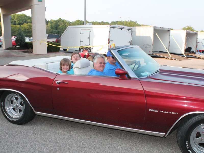 John (flash) and Joan in Joans 1972 Malibu Convertible. 
Who's that in the back seat ?  Looks like my kids, Leah and Jacob.