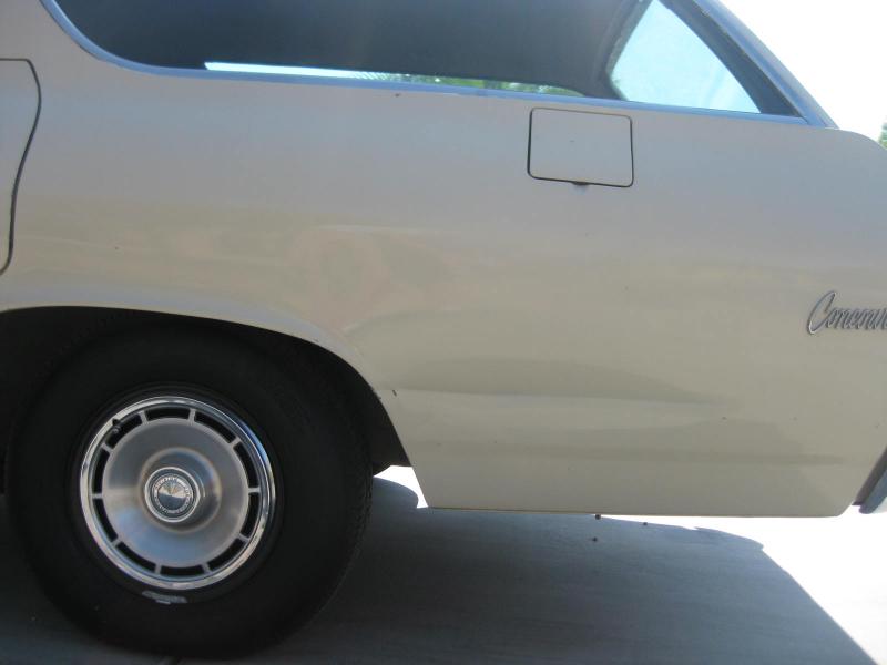 Original 14x6 wheels with full hubcaps.