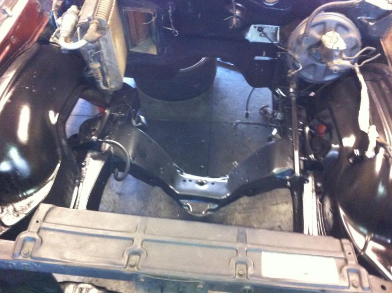 Painting engine bay and frame for the new motor, steering, and tubular A Arms.